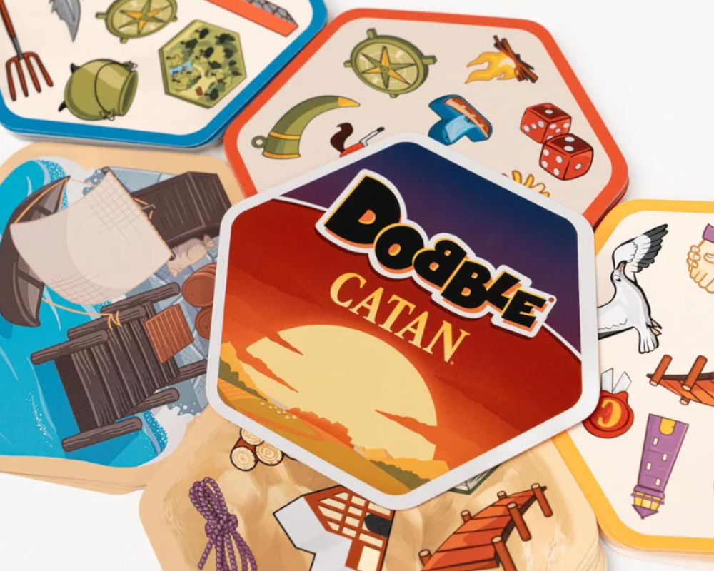 Dobble Catán: Juego de Mesa en Español. Asmodee